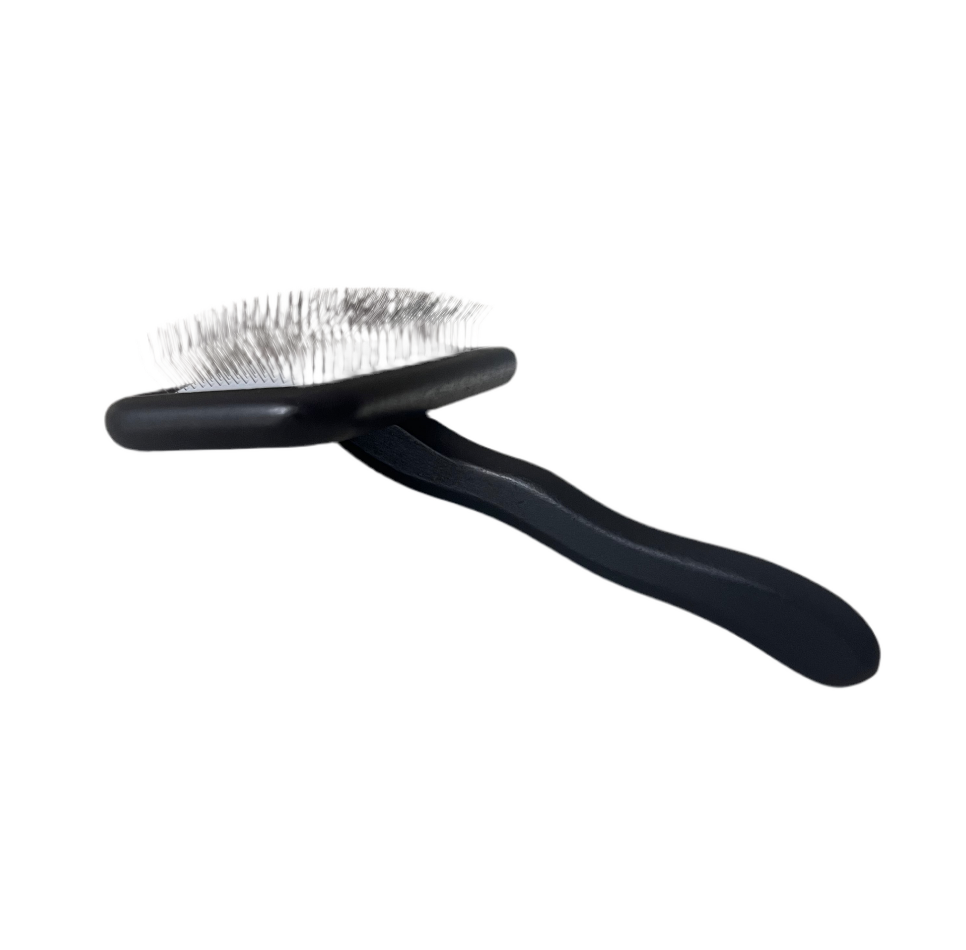 Black pet grooming brush on a white background